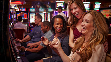 women playing slots at River City Casino